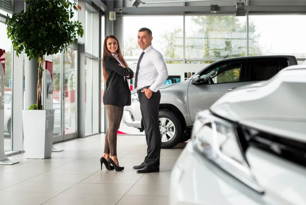 man women together car dealership